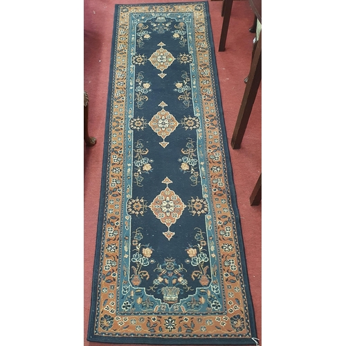 702 - A Blue ground Runner.
L 230 x 97 cm approx.