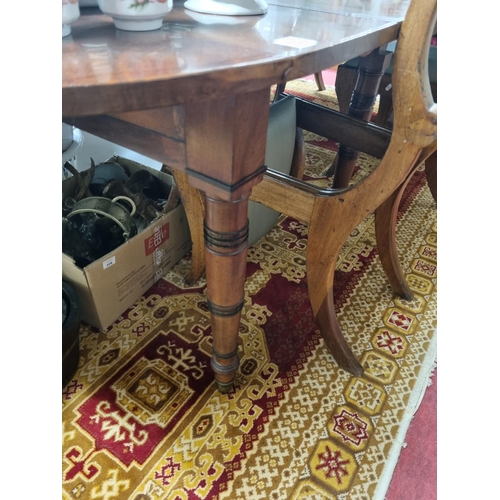 761 - A good 19th Century Mahogany two leaf Dining Table with drop ends with unusual mechanism, on turned ... 