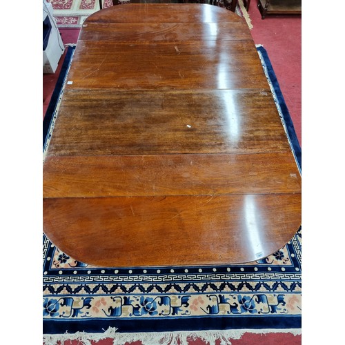 761 - A good 19th Century Mahogany two leaf Dining Table with drop ends with unusual mechanism, on turned ... 