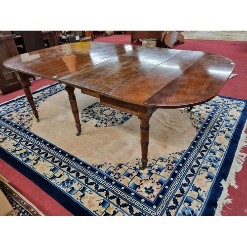 761 - A good 19th Century Mahogany two leaf Dining Table with drop ends with unusual mechanism, on turned ... 