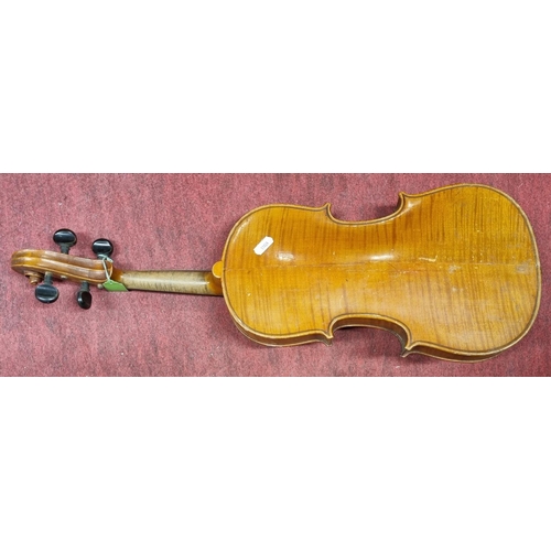 772 - Sold on Behalf of Charity, uncollected Lot.
Joseph Guarnerius fecit. A cased Violin with bow. 19th C... 