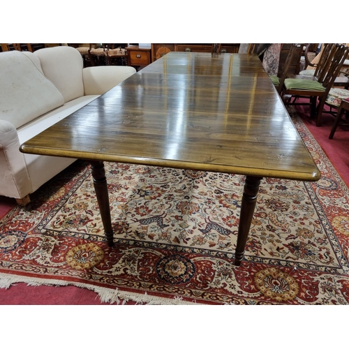 861 - A very large three leaf Dining Table with pull out centre on turned supports. 109 x 290 x H 77 cm ap... 