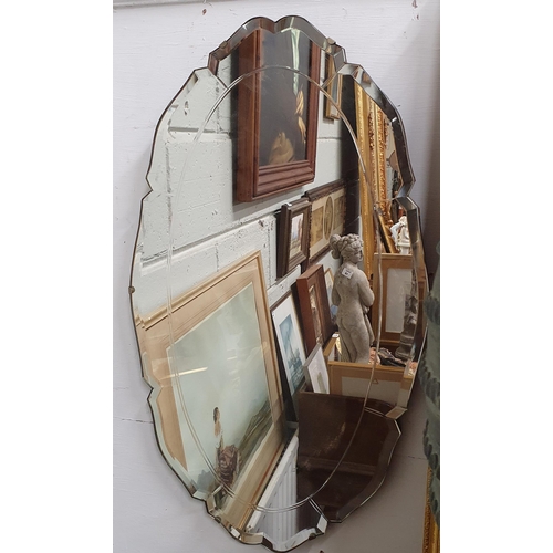 34 - An early 20th Century bevelled edge Mirror.
68 x 39 cm approx.