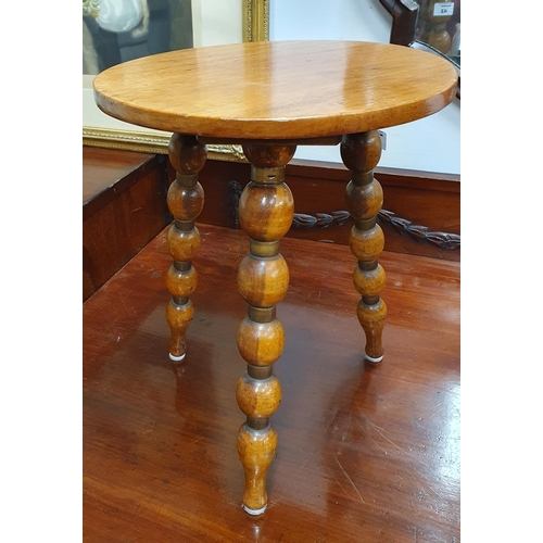 42 - A late 19th early 20th Century circular Milking Stool on bobbin turned supports. D 30 x H 37 cm appr... 