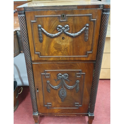 44 - Of Superb quality, an early 19th Century Mahogany pedestal Sideboard with swagged carved doors and t... 