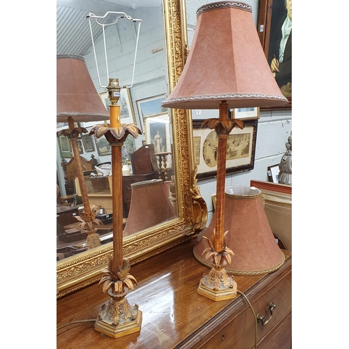 8 - A good pair of modern Table Lamps with reeded shafts. (one shade damaged). H 67 cm approx.