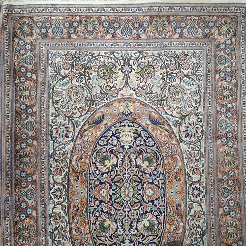 80 - A nice cream ground Rug with multi borders and central medallion design. 122 x 190 cm approx.