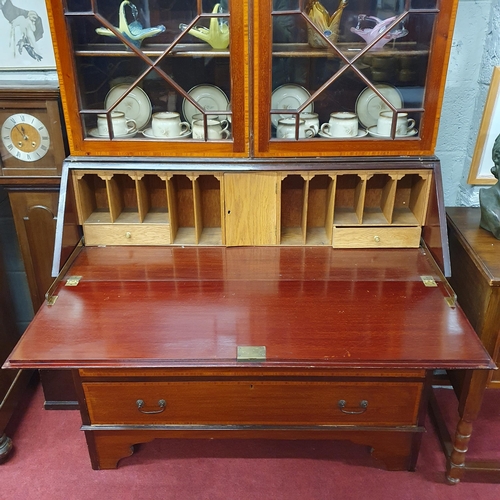 133 - An Edwardian Mahogany and inlaid bureau Bookcase with astragal glaze top and shell motif flap, with ... 