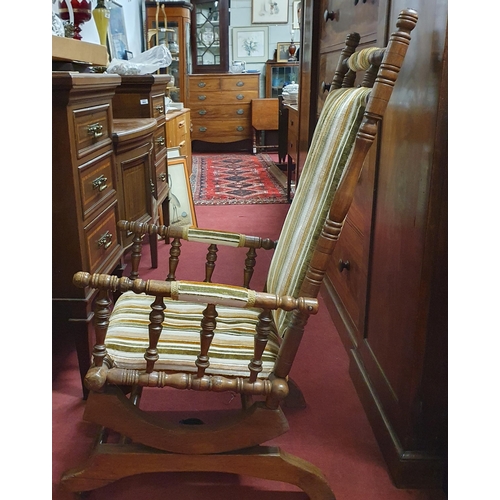 241 - An early 20th Century Arts and Crafts Rocking Chair, possibly American. W 57 x SH 40 x BH 111 cm app... 