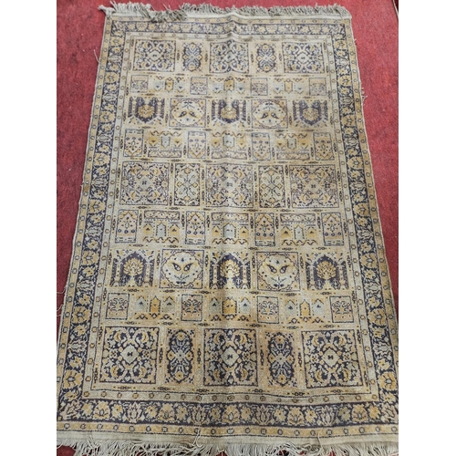 817 - A well worn Rug 175 x 117 cm approx.