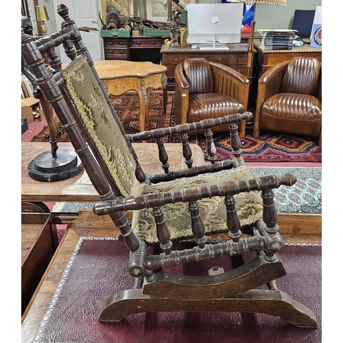 827 - An early 20th Century child's Rocking Chair. H 66 cm approx.