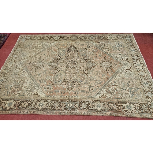 847 - A large washed Persian Heriz Carpet with traditional design design. L 353 x W 262 cm approx.