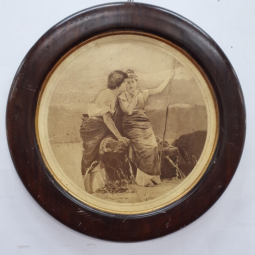 944 - A circular Print of Lovers in a wood frame. 66 cm in diameter approx.