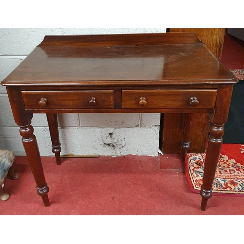 278 - An early 19th Century Mahogany two drawer Side Table on turned supports. 87 x 45 x H 79 cm approx.