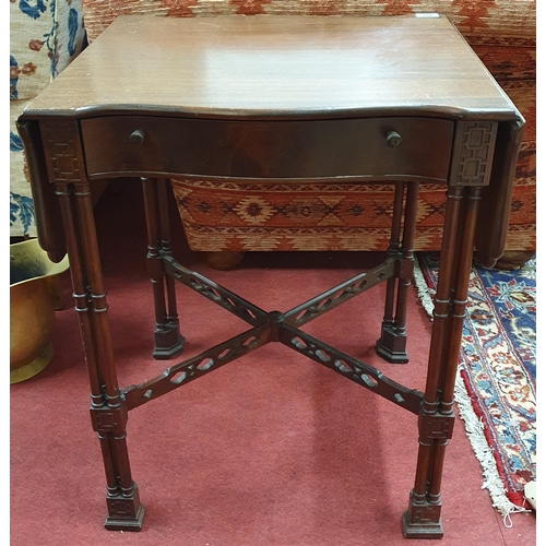 429 - A reproduction Mahogany Chinese Chippendale Table with drop leaves on turned supports. 44 x 94 x H 6... 