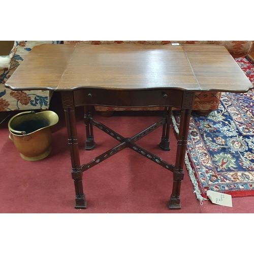 429 - A reproduction Mahogany Chinese Chippendale Table with drop leaves on turned supports. 44 x 94 x H 6... 