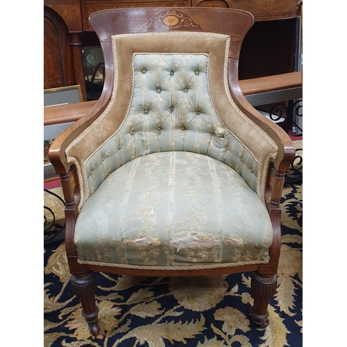 440 - An Edwardian Mahogany and Inlaid Armchair with deep buttoned back and turned reeded supports.
W 59 x... 