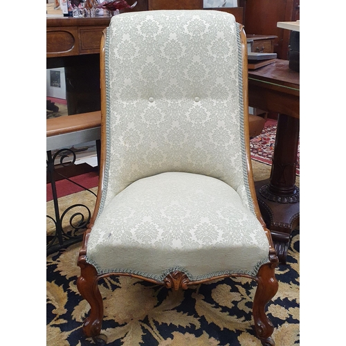 441 - A 19th Century Mahogany showframe Ladies Chair with green and cream damask upholstery on carved cabr... 