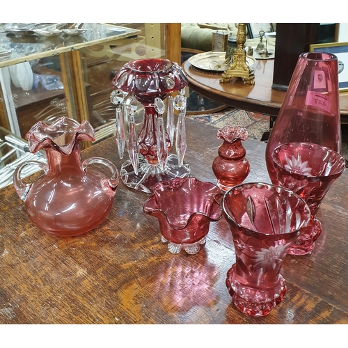 447 - A good 19th Century Cranberry Glass Candlestick along with a pair of cranberry glass bud vases and o... 