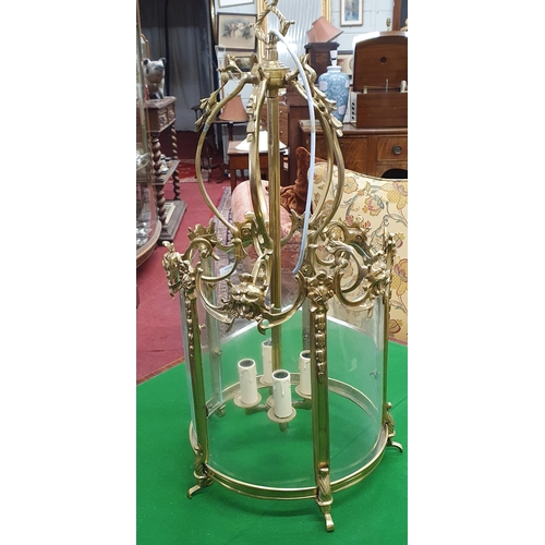 464 - A 20th Century Brass Hall Lantern with curved glass.