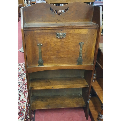 466 - An early 20th Century arts and crafts Oak Bureau with metal strap hinges. W 69 x D 27 x H 125 cm app... 