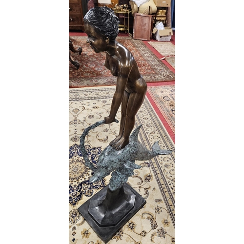 1150 - A large Bronze figural group of a girl/nymph standing on a Dolphin. H 126 cm approx.