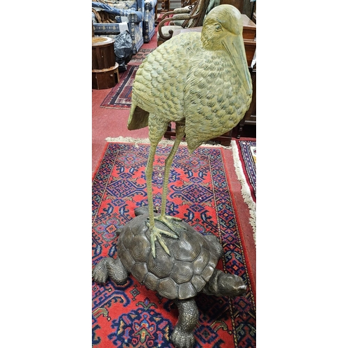 1113 - An extremely large Bronze Figure of a Stork standing on a tortoise. H 102 cm approx.