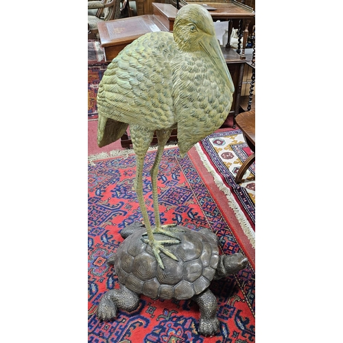 1113 - An extremely large Bronze Figure of a Stork standing on a tortoise. H 102 cm approx.