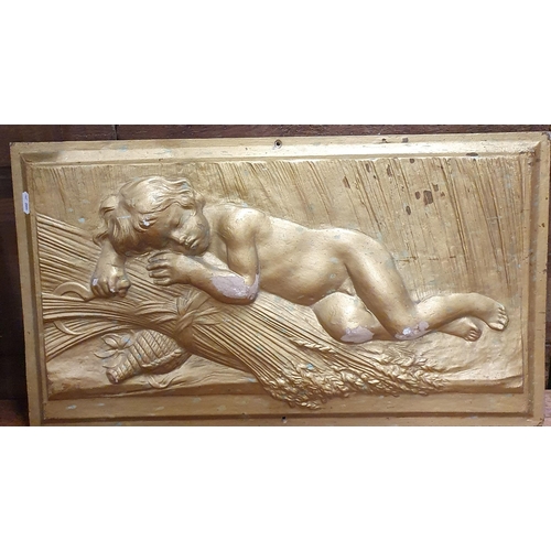 865 - A lovely pair of Gilded Wall Plaques depicting cherubs lying on sheaves of wheat. W 61 x 35 cm appro... 