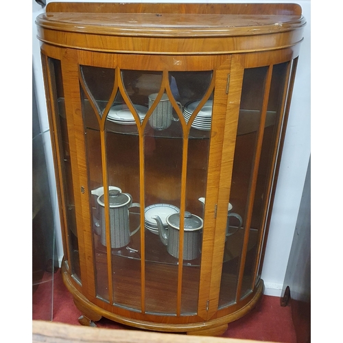 491 - An early 20th Century Walnut bow fronted Display Cabinet with glazed single door. W 86 x 36 x H 121 ... 