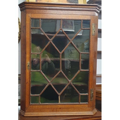 495 - A good early 19th possibly 18th Century Oak wall hanging corner Display Cabinet with brass strap hin... 