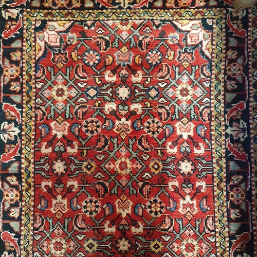 526 - A full pile hand woven Red ground Runner with an all over floral design from the Hamadan region of I... 