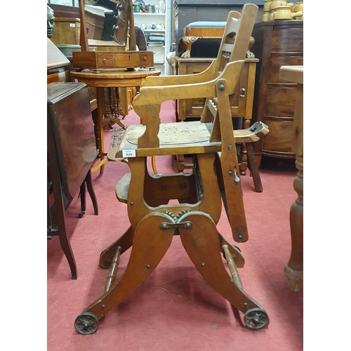 528 - An early 20th Century child's Chair on metal wheels.