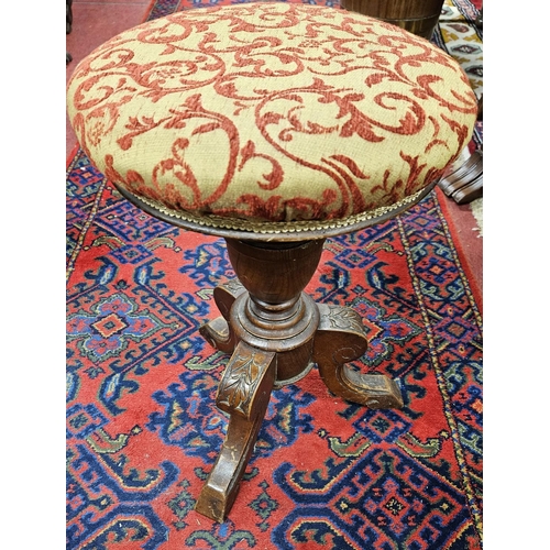 1174 - A 19th Century Mahogany revolving Piano Stool on tripod base. D 31 x H 49 cm approx.