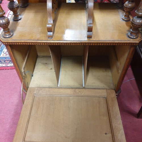 557 - A 19th Century Oak gallery topped Music Cabinet with single fall flap door and parquetry inlaid edge... 