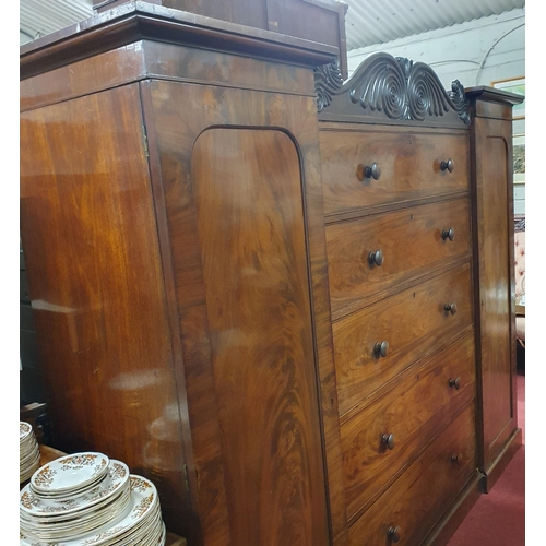 559 - An early 19th Century Mahogany Sentry Box Wardrobe of low size with a central chest flanked by singl... 