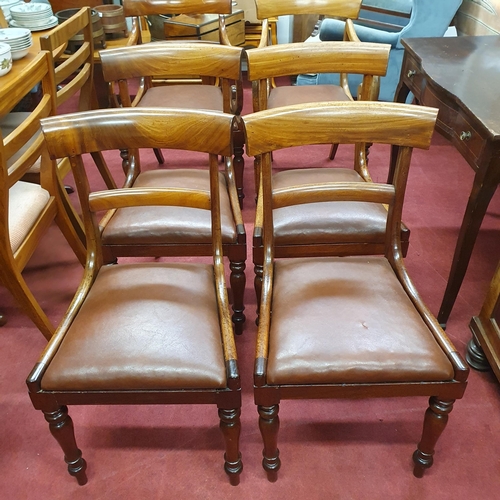 596 - A good set of Regency Mahogany Dining Chairs of simple form on turned reeded supports.