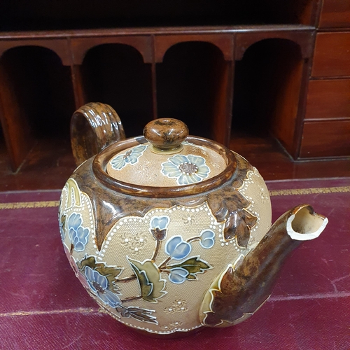 606 - A group of 19th Century Royal Doulton salt glaze Items to include two teapots and a lidded jug.