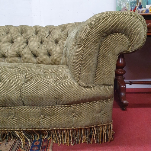 635 - Of really good quality. A large Chesterfield Sofa with green deep buttoned upholstery. W 215 x D 94 ... 