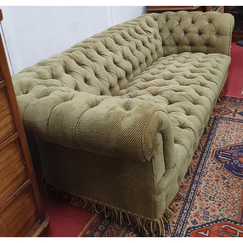 635 - Of really good quality. A large Chesterfield Sofa with green deep buttoned upholstery. W 215 x D 94 ... 