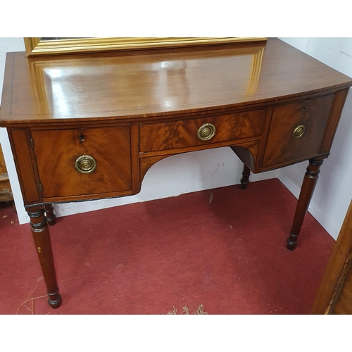 655 - A Regency Mahogany bow fronted Side Table of neat proportions with ebony strung inlay on turned supp... 