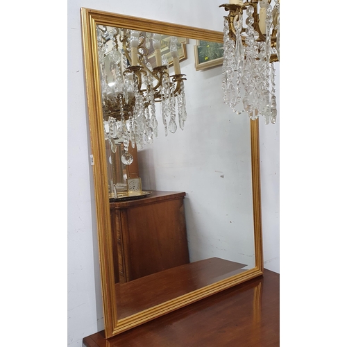 656 - A modern reproduction Gilt Mirror with bevelled edge glass. 110 x 84 cm approx.