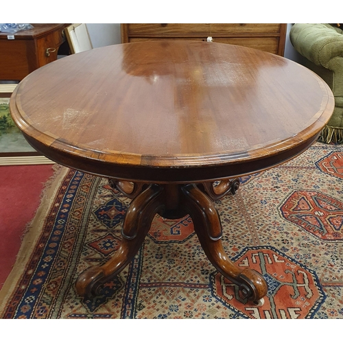 670 - An early to mid 19th Century Mahogany Oval Supper Table with Rosewood cross banded top on quatrefoil... 