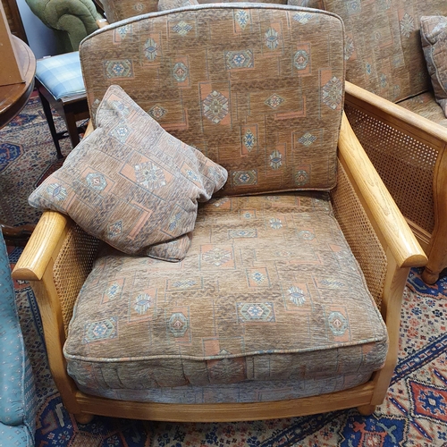 676 - A good Ercol three piece Berger Suite with cane oak sides. W 139 x D 86 cm approx.