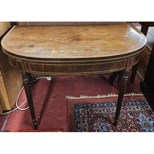 1175 - A good Regency Mahogany and Inlaid foldover Card Table on turned reeded supports in the Gillows styl... 