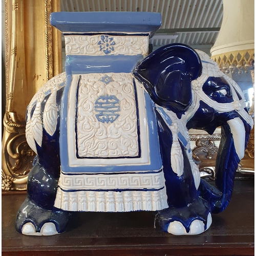 741 - A good pair of late 19th early 20th Century Table Stands depicting Elephants. Hand painted blue and ... 