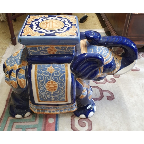 741 - A good pair of late 19th early 20th Century Table Stands depicting Elephants. Hand painted blue and ... 