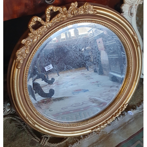 747 - A good circular Timber and plaster Gilt mirror with bevelled mirror glass. D 67 cm approx.