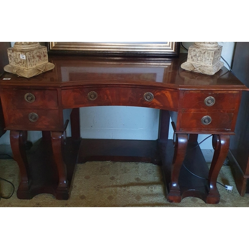 748 - A good early 19th Century kneehole Desk with concave drawered front on cabriole supports. W 123 x 57... 