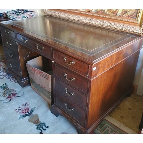 763 - A large Walnut and Veneered pedestal Desk with green leather insert top. 152 x 91 x H 76 cm approx.